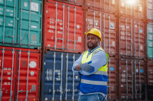 a man in front of containers