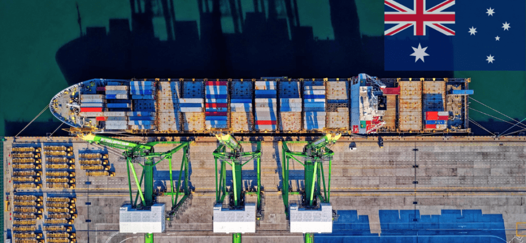 cargo ship in the port, australian flag in top right corner